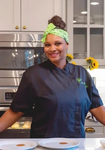 Chef Delsia smiling in the kitchen