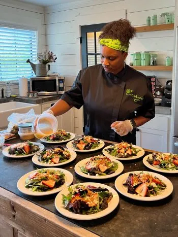 Chef Delsia making salads in the kitchen